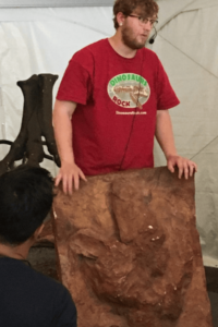 Dinosaurs Rock Instructor show how huge a T-REX Footprint actually is