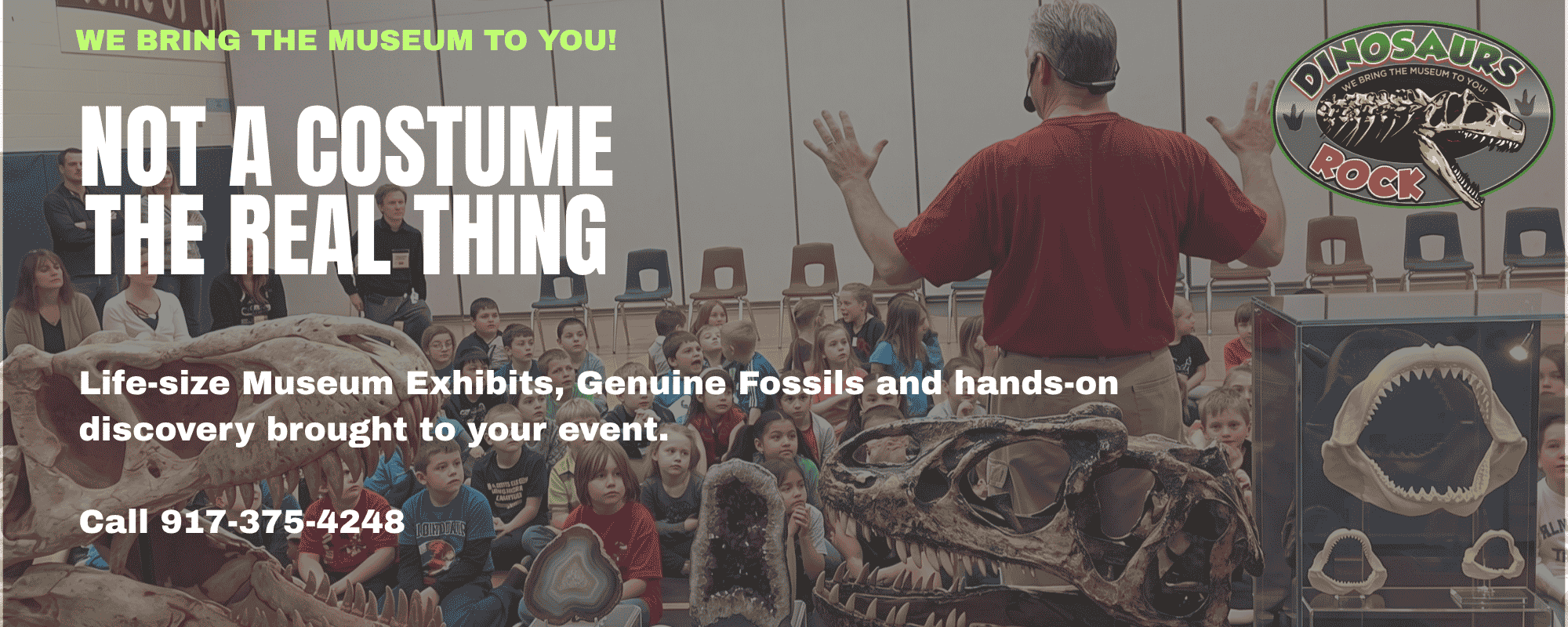Dinosaurs Rock instructor in front of th group of students at a school assembly