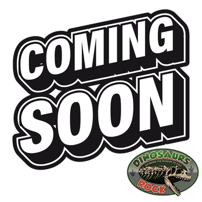 Bold 'COMING SOON' graphic with a circular 'DINOSAURS ROCK' logo in the bottom-right corner.